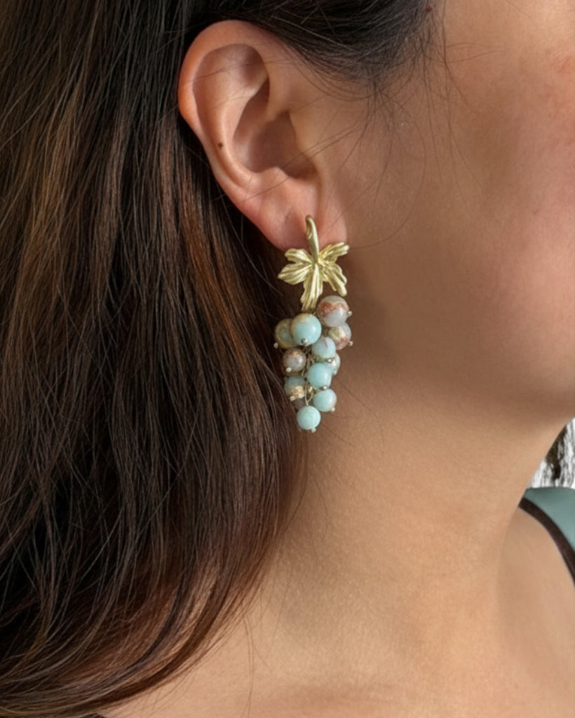 Model wearing vintage grape cluster earrings 