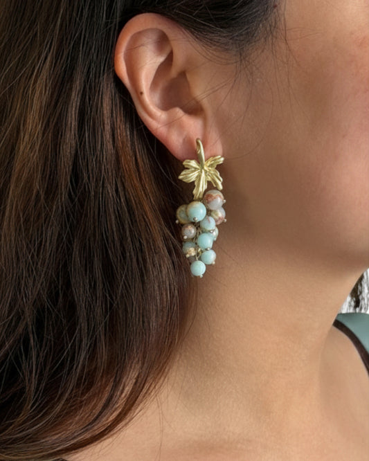 Model wearing vintage grape cluster earrings 