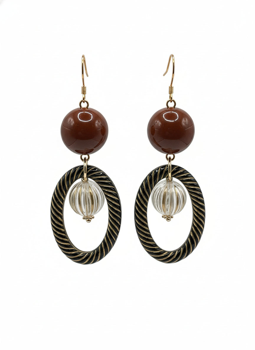 Vintage resin antique bead drop earrings with brown spheres and twisted oval rings on white background