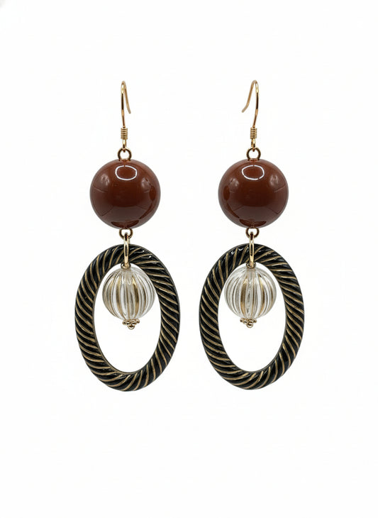 Vintage resin antique bead drop earrings with brown spheres and twisted oval rings on white background