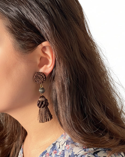 Model wearing handmade Japanese brown tassel earrings with tassel drop detail