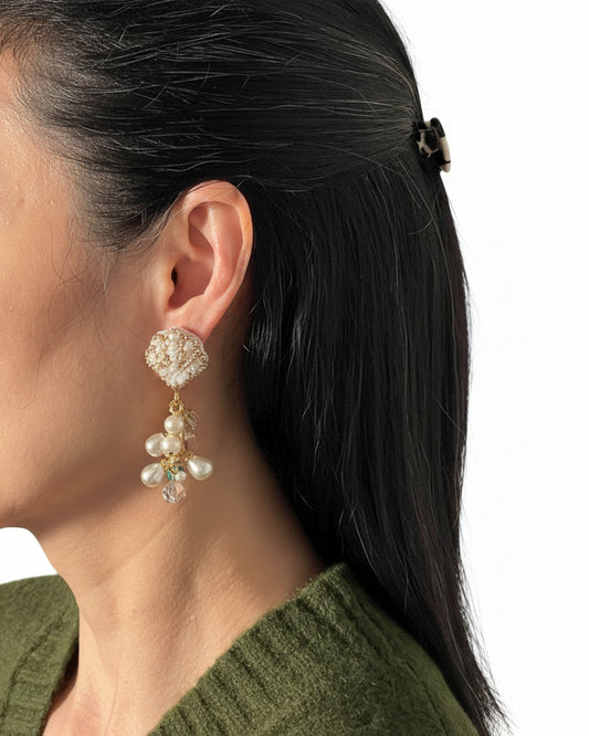 Model wearing made in Japan pearl cluster statement earrings
